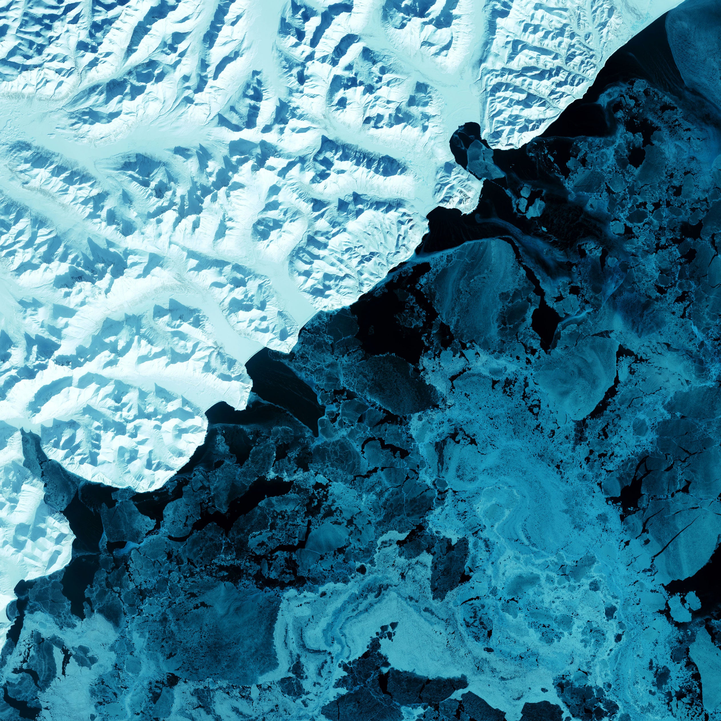 An aerial view of a snow covered mountain